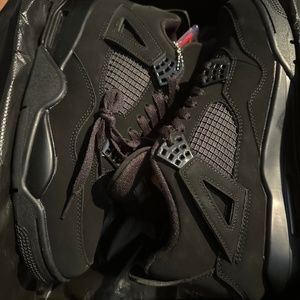 Black Cat Jordan 4’s